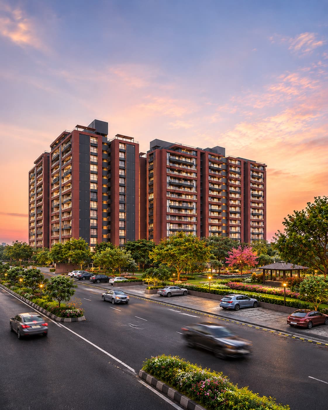 Parmeshwar Group residential towers at sunset, above a landscaped road