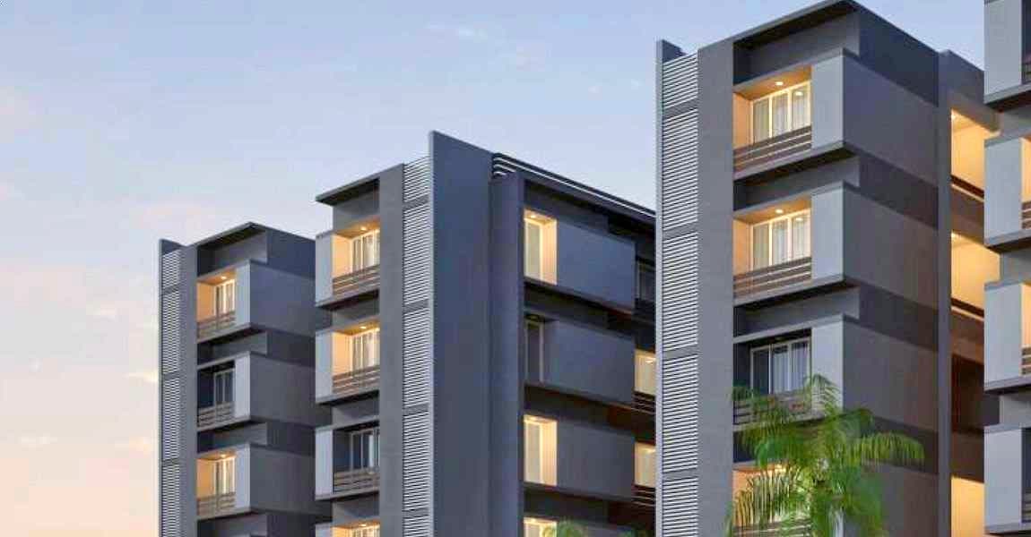Parmeshwar 5, mid-rise apartment blocks in grey and charcoal, lit at dusk