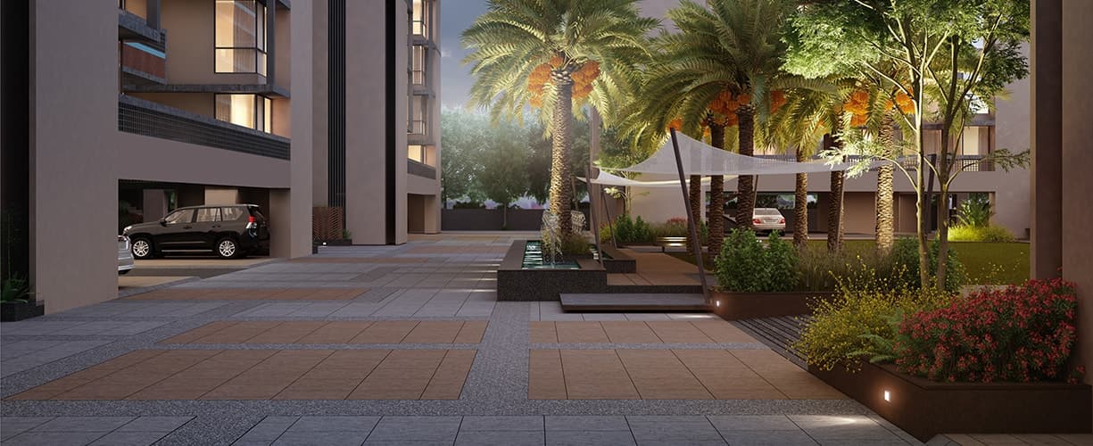 Paved entrance court with palms and a shaded seating canopy