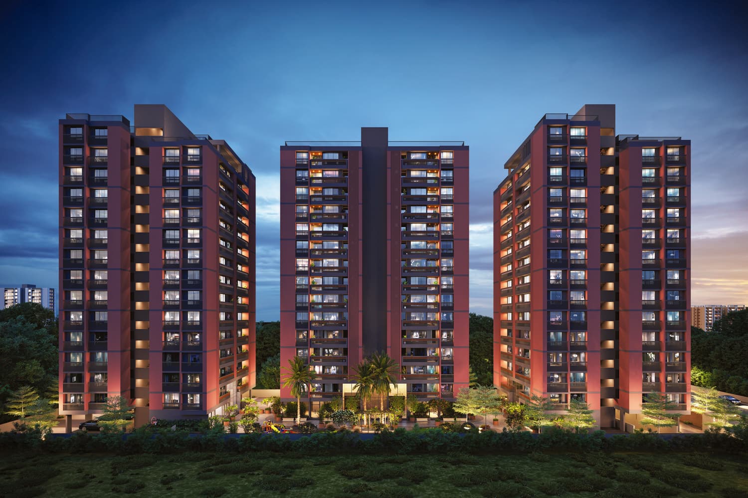 The full complex at dusk, showing all towers and the lit podium