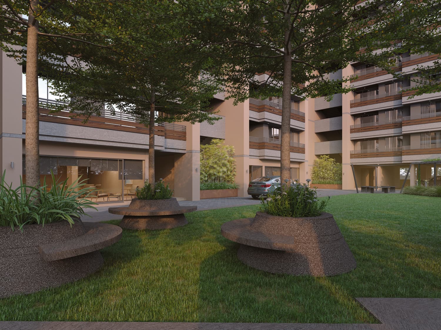 Lawn and sculpted seating mounds at the base of the towers